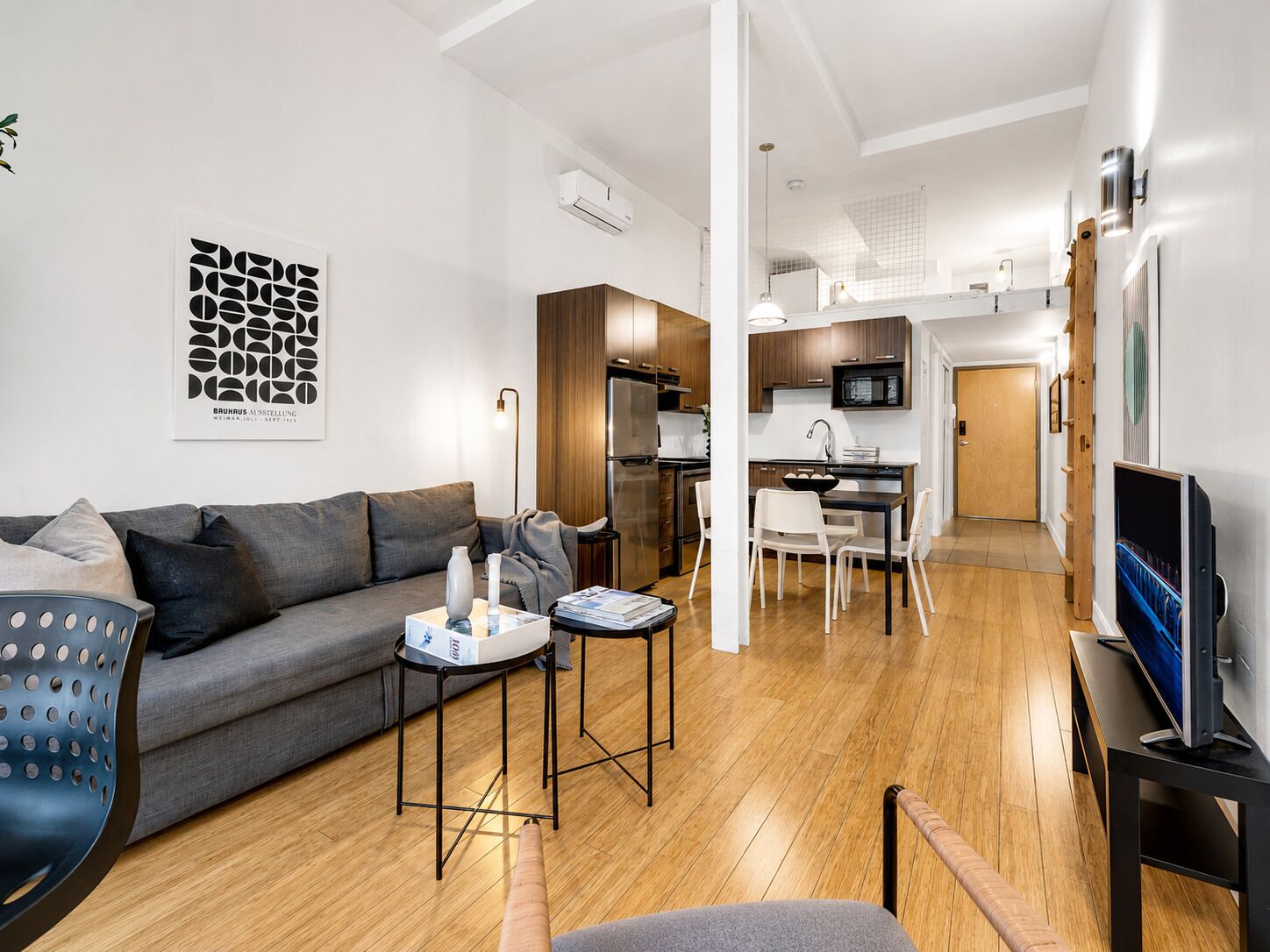 Deluxe Studio Suite, 1 Queen Bed with Sofa bed, City View, Mezzanine (The Main 206) | Living area | 49-inch flat-screen TV with digital channels, Smart TV, offices
