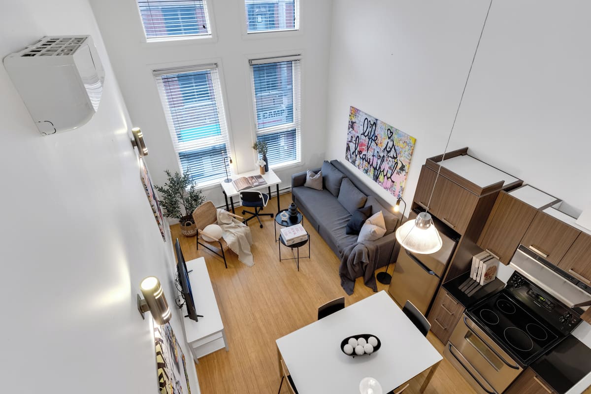 Superior Apartment, Multiple Beds, City View, Mezzanine (The Main 302) | Living area | 49-inch flat-screen TV with digital channels, Smart TV, offices