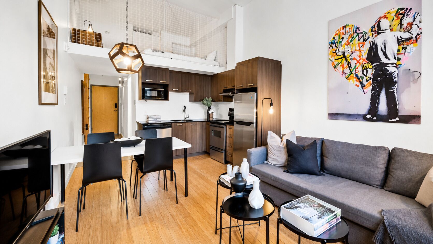 Premium Apartment, 1 Bedroom, City View, Mezzanine (The Main 306) | Living area | 49-inch flat-screen TV with digital channels, Smart TV, offices