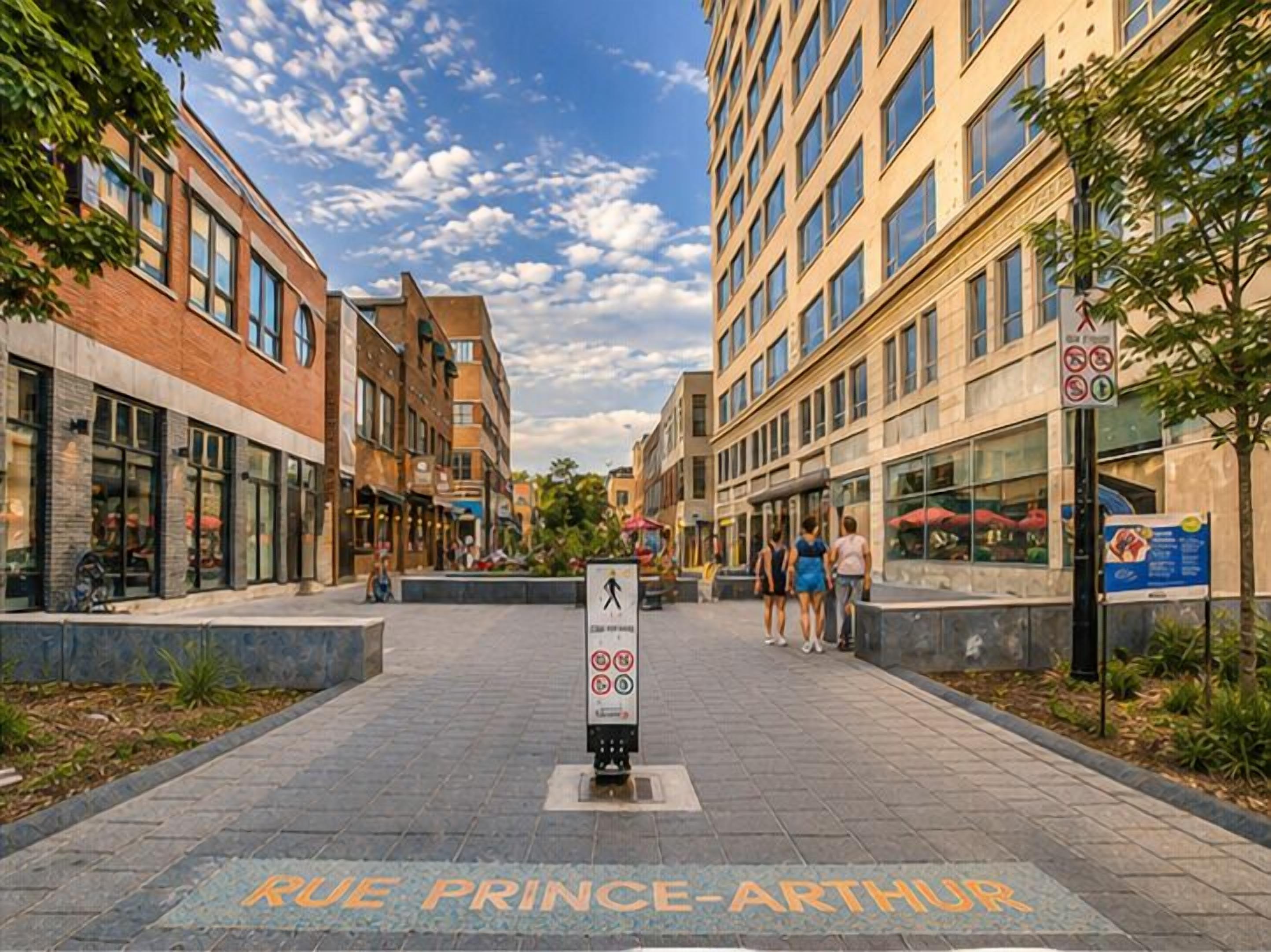 A pedestrian walkway with a sign reading 'RUE PRINCE-ARTHUR' and a crosswalk.