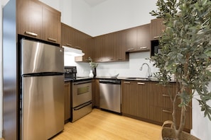 Superior Apartment, Multiple Beds, City View, Mezzanine (The Main 301) | Private kitchen | Full-size fridge, microwave, oven, stovetop