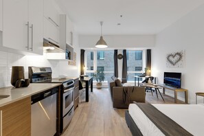 Deluxe Studio Suite, 1 Queen Bed with Sofa bed, City View (Downtown 304) | Living area -  Liv MTL - Downtown (Montreal)