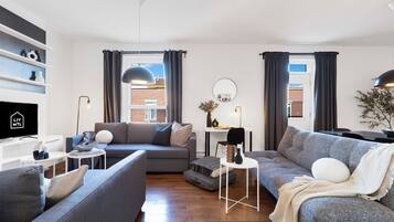 Premium Apartment, 4 Bedrooms, Pets Allowed, City View (The CH3 - Suite 3) | Living area | 60-inch Smart TV with digital channels, TV, Netflix