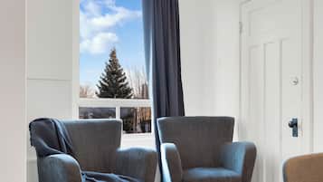 Premium Apartment, 4 Bedrooms, Pets allowed, City View (The CH3 - Suite 2) | Living area | 60-inch Smart TV with digital channels, TV, Netflix