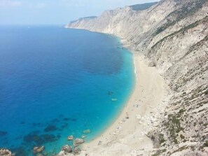 A coastal landscape with a sandy beach and rocky cliffs. - Spacious 5 Bed Villa With Pool in Kefalonia (Kefalonia)