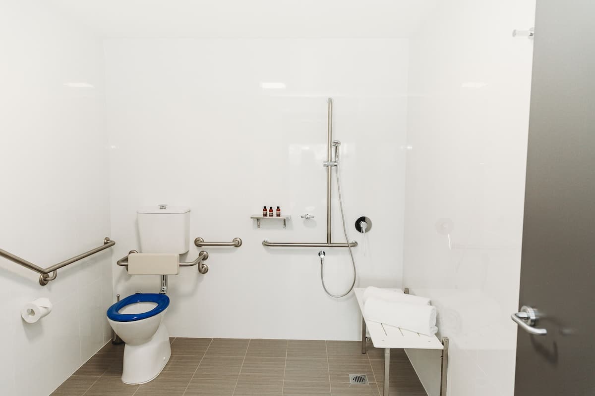 accessible king, ensuite bathroom | bathroom | shower, towels