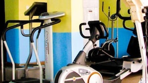 A gym with treadmills and elliptical machines. - Londa Hotel (Port Harcourt)