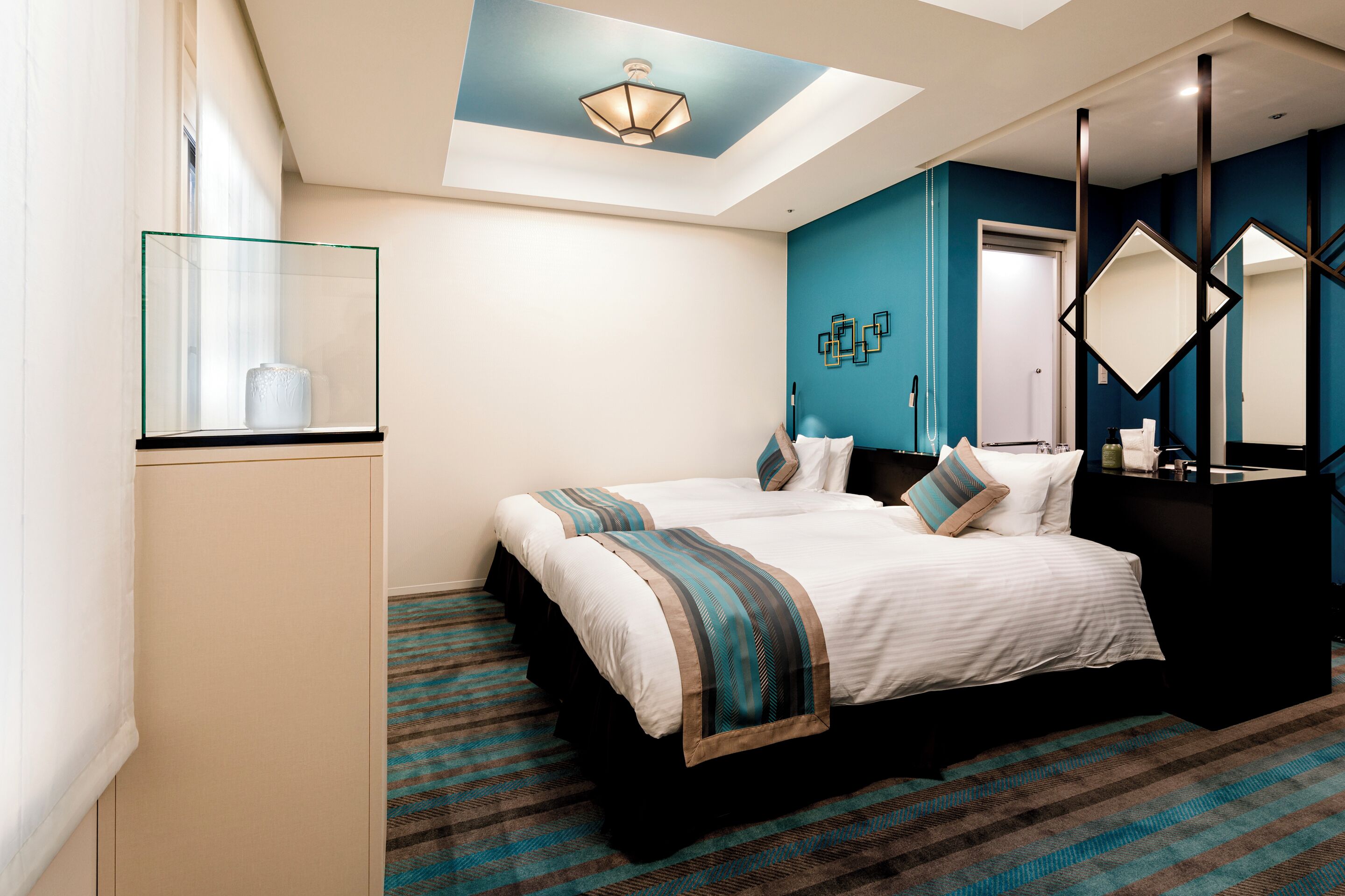 deluxe twin room | down duvets, in-room safe, desk, free wifi