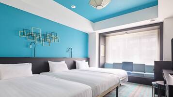 A hotel room with two beds, a desk, a chair, a window with curtains, and a geometric wall decoration.
