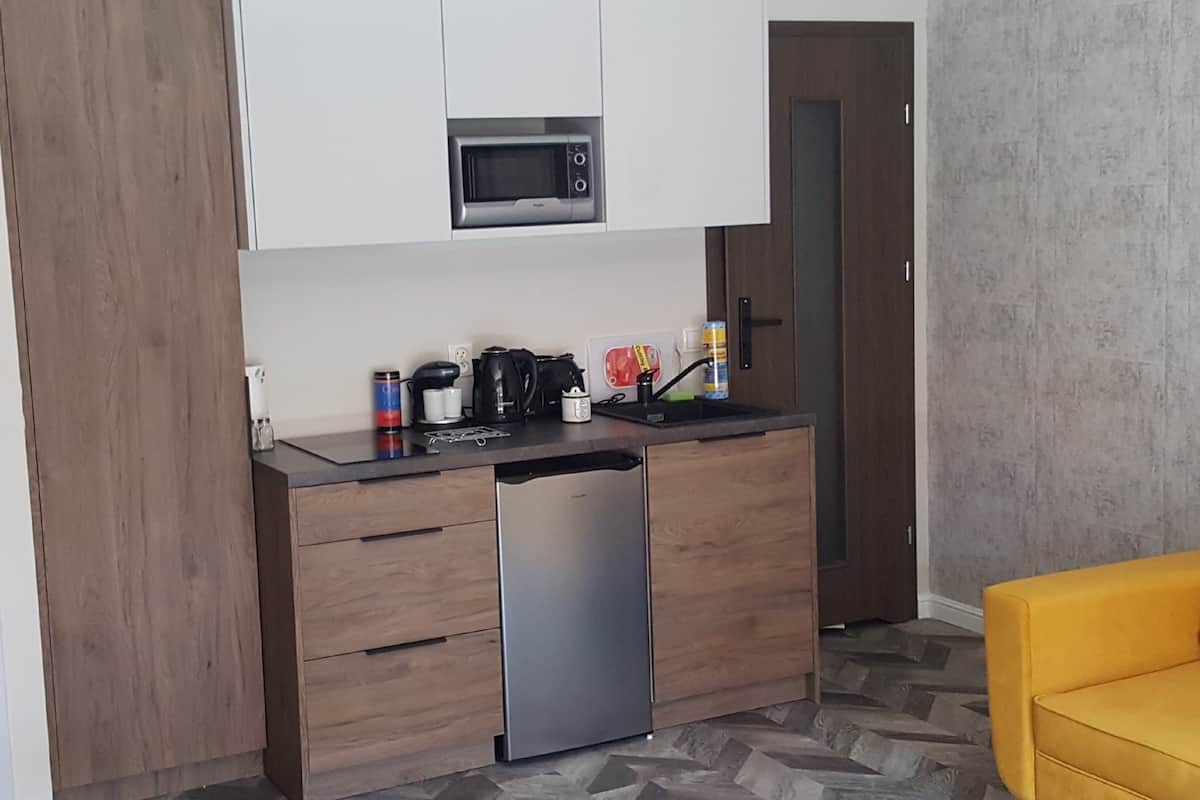 Apartamento (with balcony - 5 A) | Cozinha privada | Geladeira, micro-ondas, fogão, cooktop