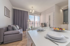 Apartment, 2 Bedrooms (79B) | Living room | Flat-screen TV