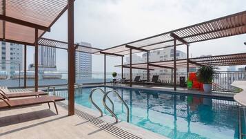 Outdoor pool, open 6:00 AM to 9:00 PM, sun loungers