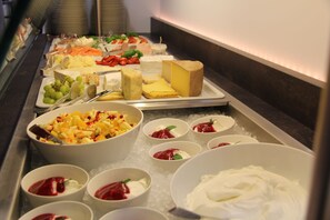 Indulge in a diverse spread of cheeses, fresh fruits, and savory dips.
