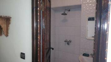 Shower, rainfall showerhead, hair dryer, towels