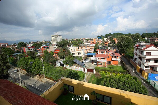 A residential area with various buildings, including a prominent multi-story structure.