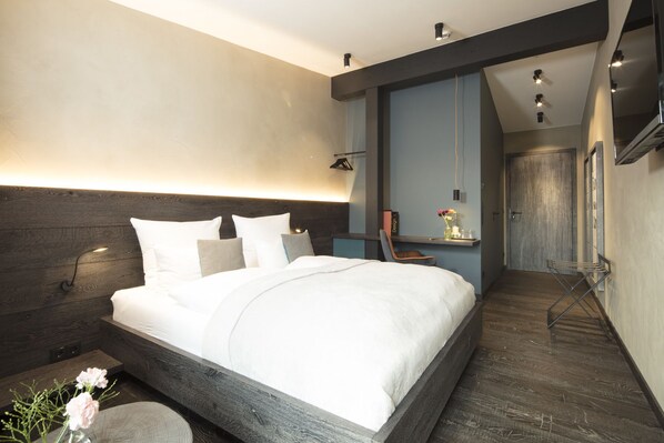 Design tweepersoonskamer | Hypoallergeen beddengoed, donzen dekbedden, een gratis minibar