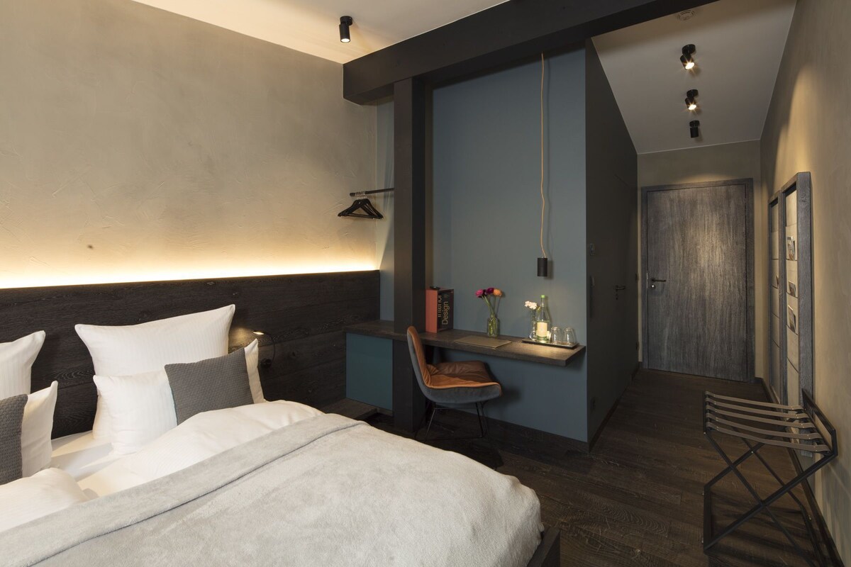 Hypoallergeen beddengoed, donsdekens, een gratis minibar, een bureau