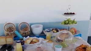 A breakfast buffet with various food items and beverages on a table. - Orlando Bay View (Balestrate)