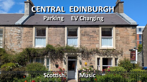 A traditional stone building with a sign indicating it is a guest house. - Averon  Guest House (Edinburgh)