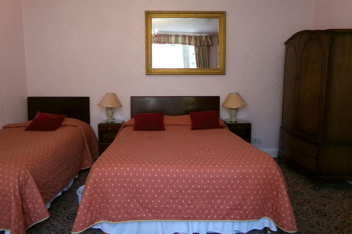 Triple Room with Shared Bathroom | Individually decorated, individually furnished, desk, blackout curtains
