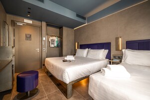 Triple Room, Balcony, City View | Down comforters, minibar, in-room safe, desk