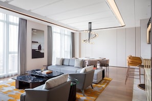 Presidential Suite, 1 King Bed | Living room | 49-inch TV with cable channels