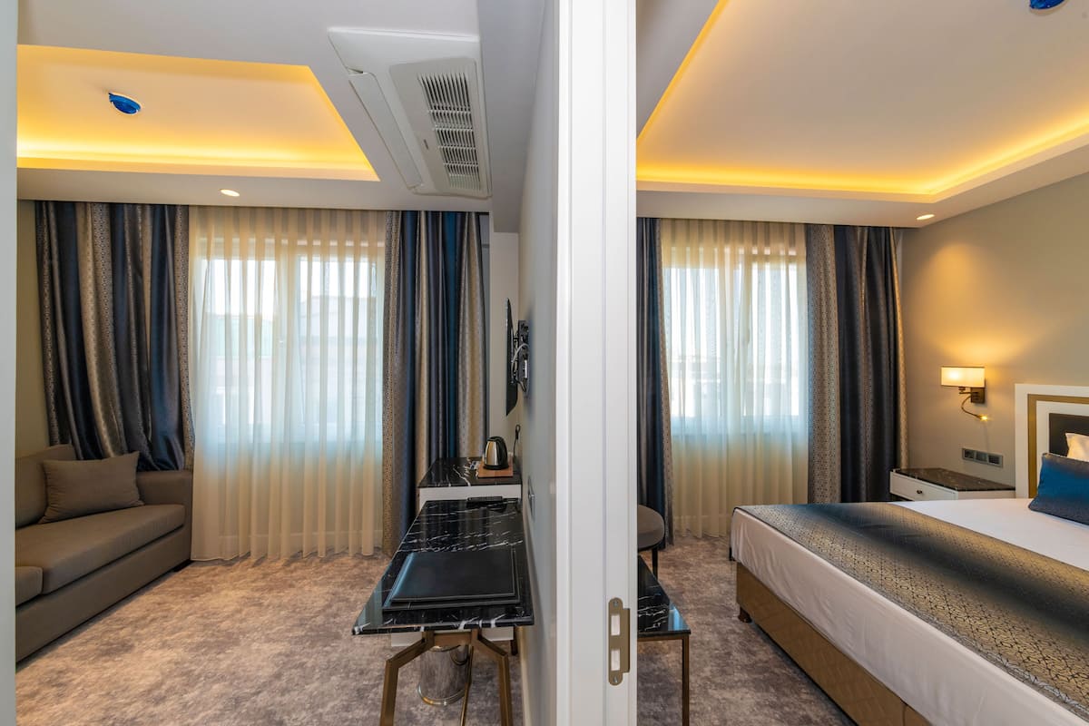 Suite Junior | 1 kamar tidur, seprai Frette Italia, seprai premium, dan minibar