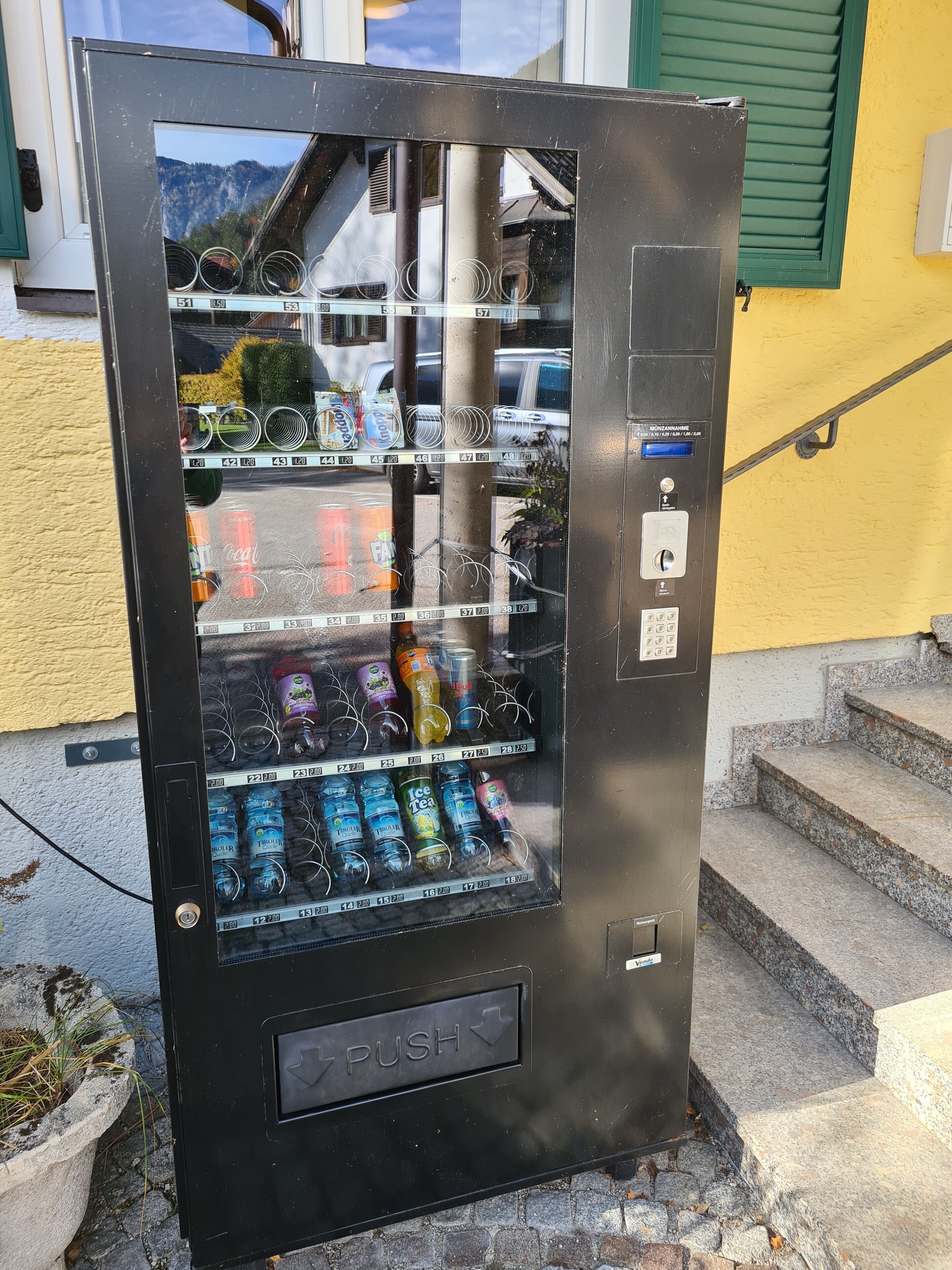 A vending machine with various beverages and snacks.