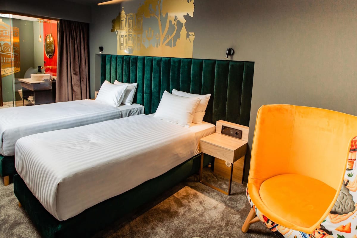 Standard Room, 2 Twin Beds | Minibar, in-room safe, desk, laptop workspace