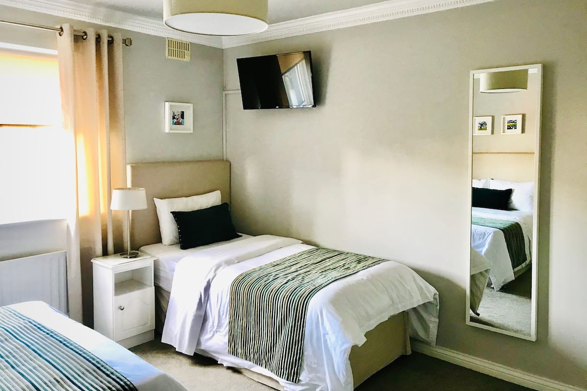 Premium bedding, desk, laptop workspace, free WiFi
