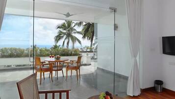 Regalia Ocean View Suite | Living area | 32-inch LED TV with cable channels, TV, DVD player