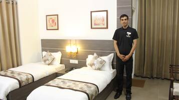 Deluxe Double Room | Living room | Flat-screen TV