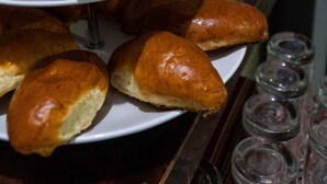 A tray of assorted baked goods and a coffee pot. - Kasas del Inka Machupicchu (Machu Picchu)