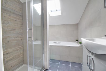 Shower, rainfall showerhead, hair dryer, towels. Nelson Serviced Apartments