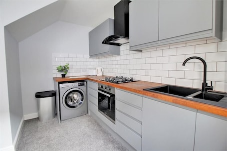 Full-size fridge, microwave, oven, stovetop. Nelson Serviced Apartments