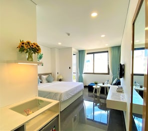 Deluxe Double Room | Living room | Flat-screen TV - Olivia Apartment (Nha Trang)