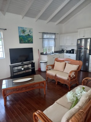 Elite Condo, 2 Bedrooms, Sea View | Living area | 55-inch flat-screen TV with cable channels, TV, Netflix - Seaview Condos (Gros Islet)