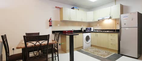 Apartment | Private kitchen | Full-sized fridge, microwave, oven, stovetop