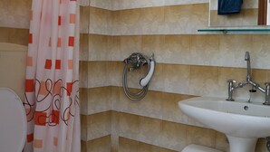 A bathroom with a shower, toilet, and sink. - Mejanis (Corfu)