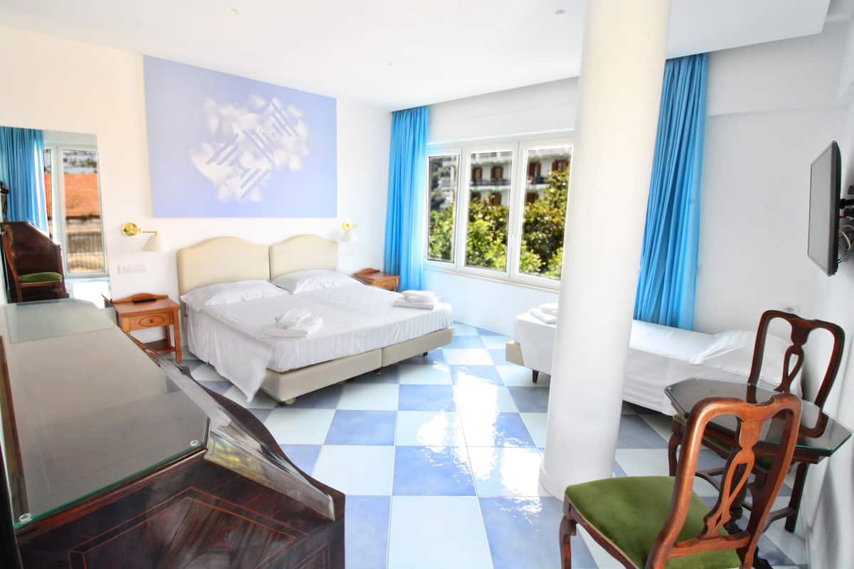 Triple Room | Minibar, in-room safe, desk, blackout drapes