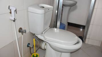 Separate tub and shower, towels, soap, toilet paper