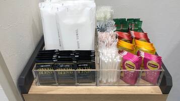 A display of various instant coffee and tea products in a store.