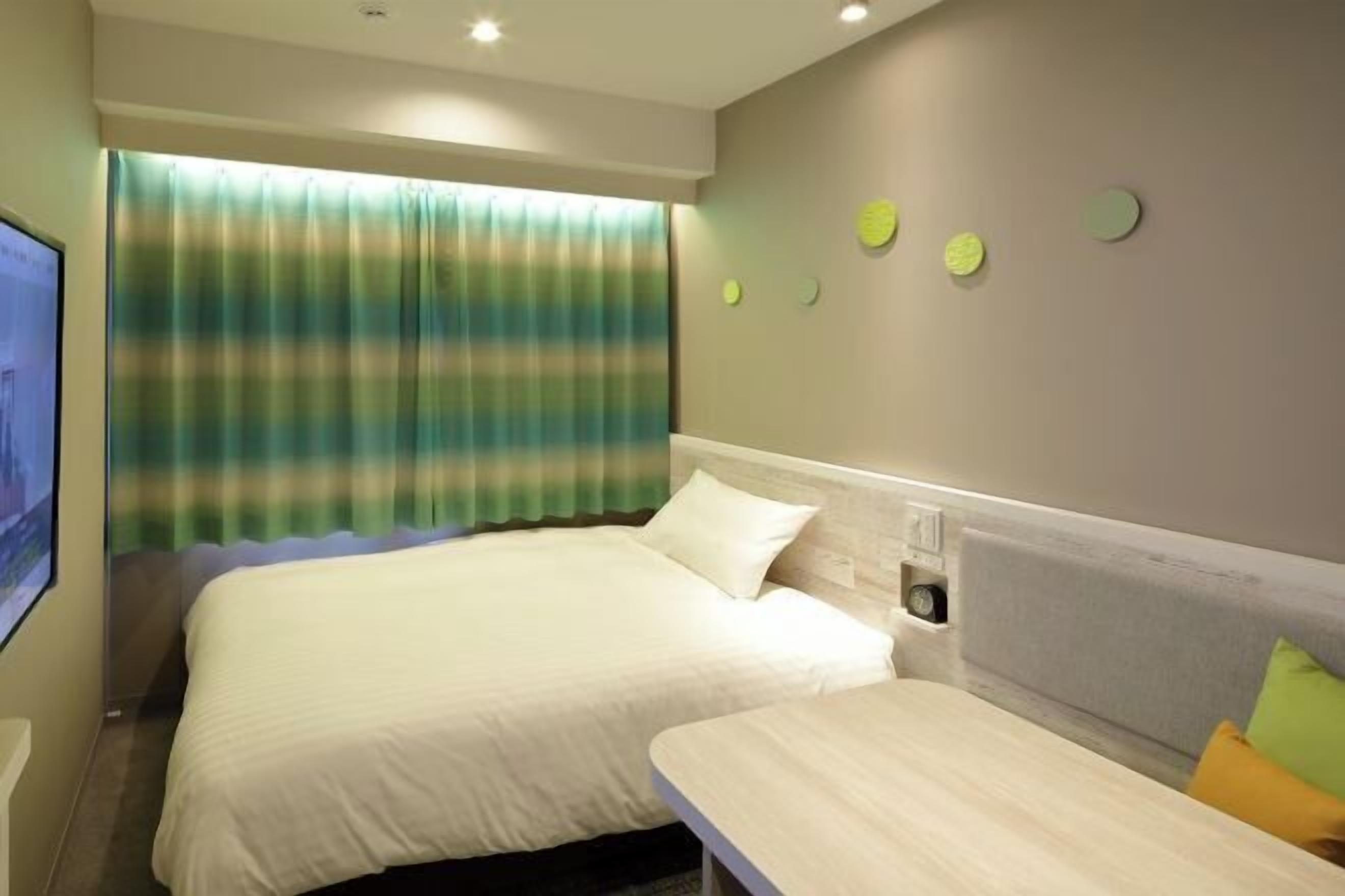 Down comforters, desk, laptop workspace, blackout drapes