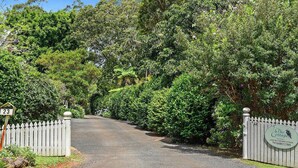 A gated entrance to a property with a sign indicating the number 23. - The Cottages (Tamborine Mountain)