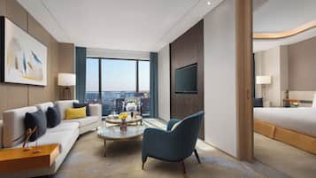 Executive Studio Suite, 1 Bedroom | Living area | TV