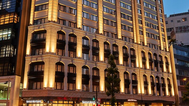 A high-rise hotel with multiple floors, large windows, and a prominent entrance with signage. - Welina Hotel Premier Nakanoshima EAST (Osaka)