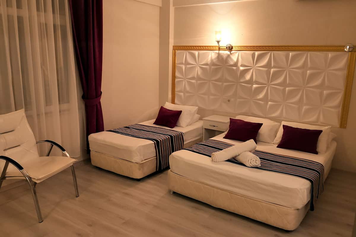 standard quadruple room | egyptian cotton sheets, premium bedding, minibar, desk