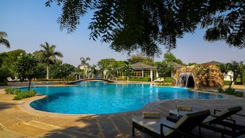 Outdoor pool, open 7:00 AM to 7:00 PM, pool umbrellas, pool loungers