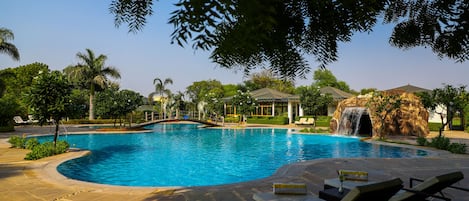 Outdoor pool, open 7:00 AM to 7:00 PM, pool umbrellas, sun loungers