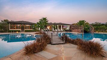 Outdoor pool, open 7:00 AM to 7:00 PM, pool umbrellas, pool loungers
